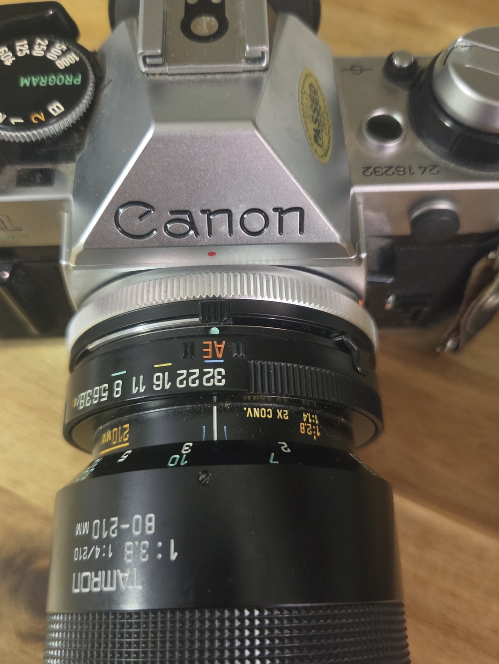 Canon Silver SLR Camera with Black Tamron 80-210mm Lens